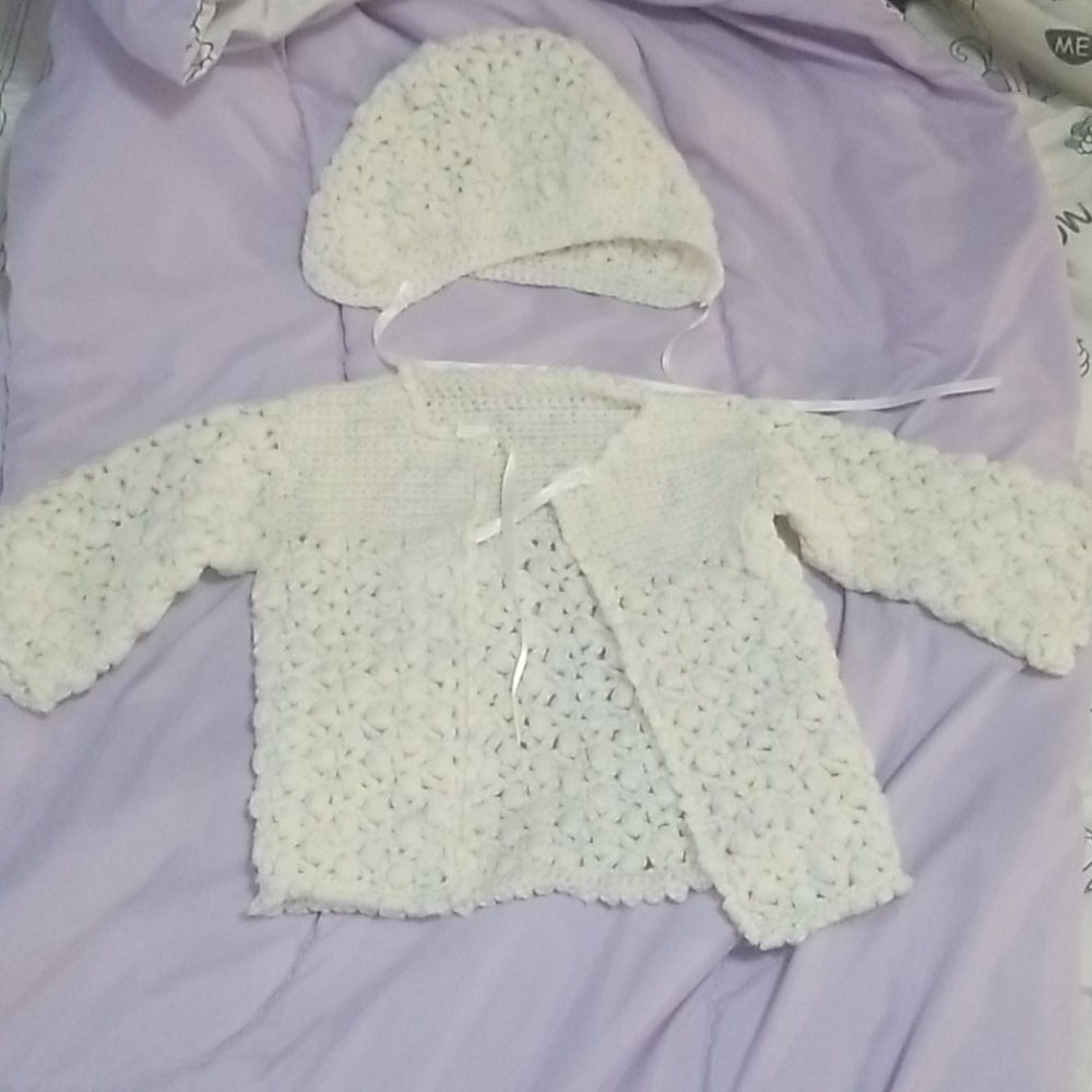 Crocheted baby hat and sweater